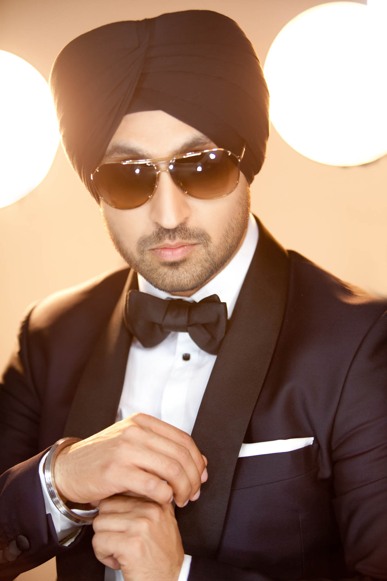 Diljit Dosanjh Photoshoot editorial close portrait with golden studio lights