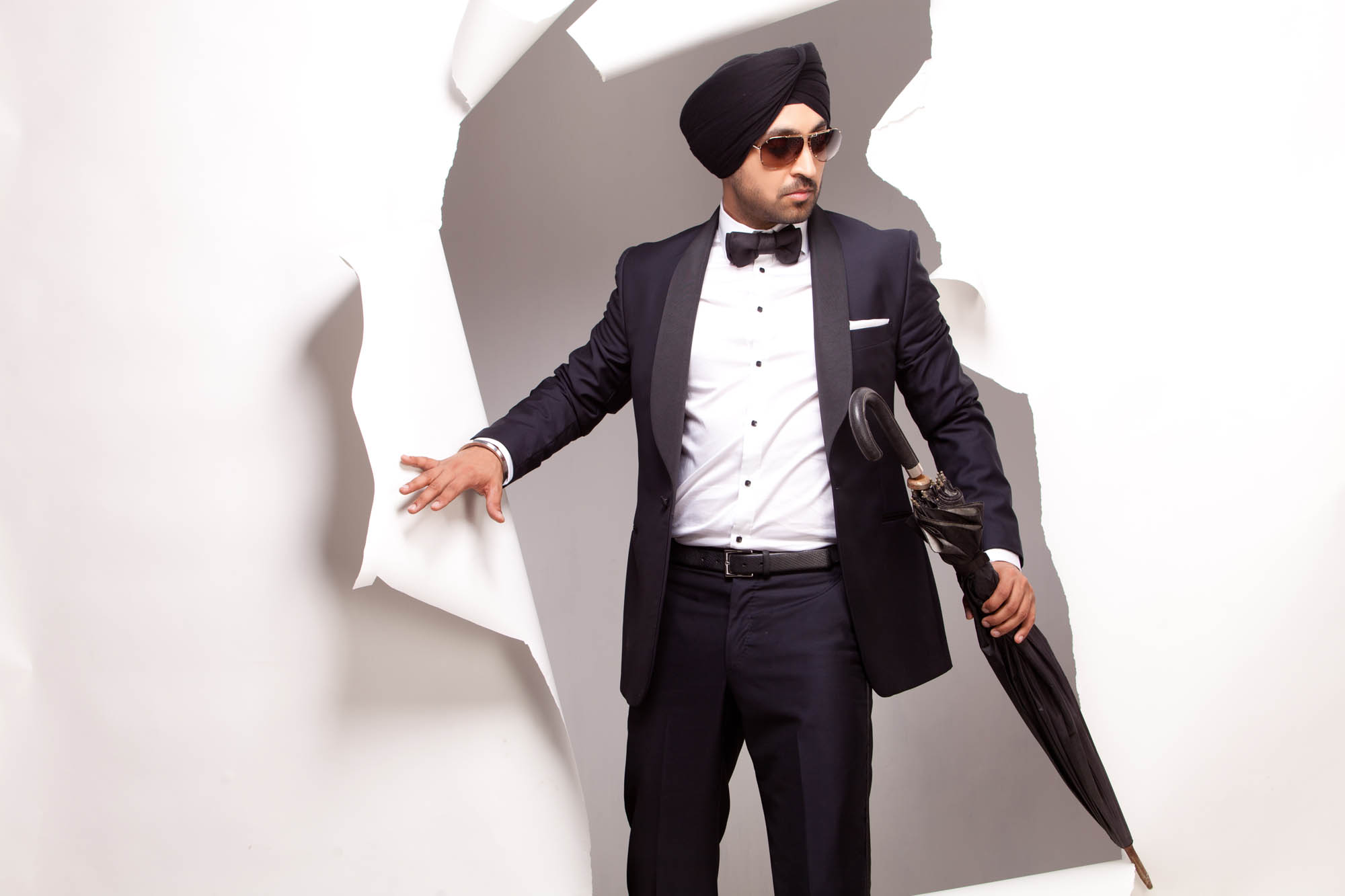 Diljit Dosanjh Photoshoot full length editorial portrait with umbrella shadow