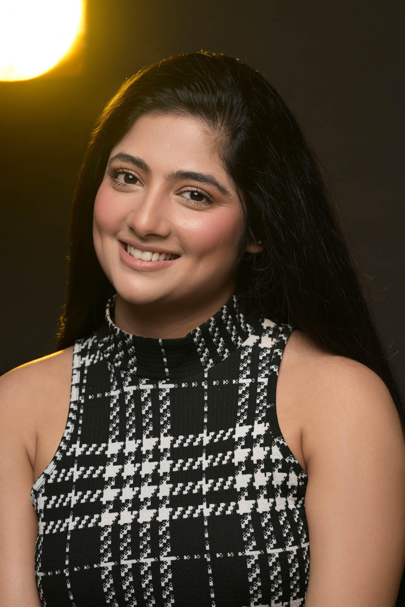 female model portfolio smiling close-up portrait in black and white look by Praveen Bhat