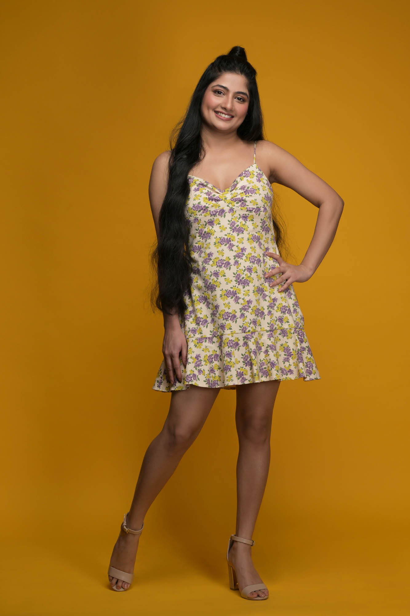 female model portfolio full-length image in floral top and denim jeans